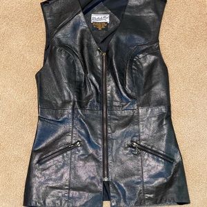 Small Leather and Polyester vest. Like new. I don’t think it was ever worn.